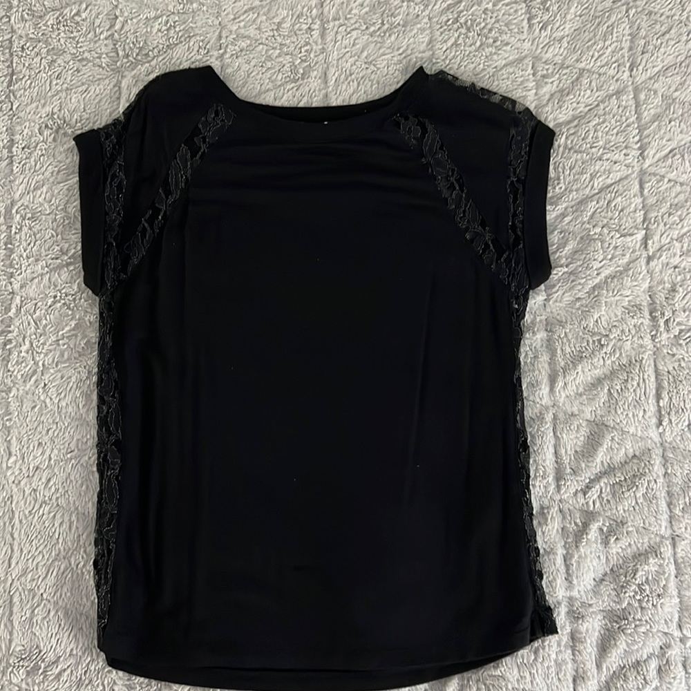Black top with lace sides, shoulder, and sleeve detail